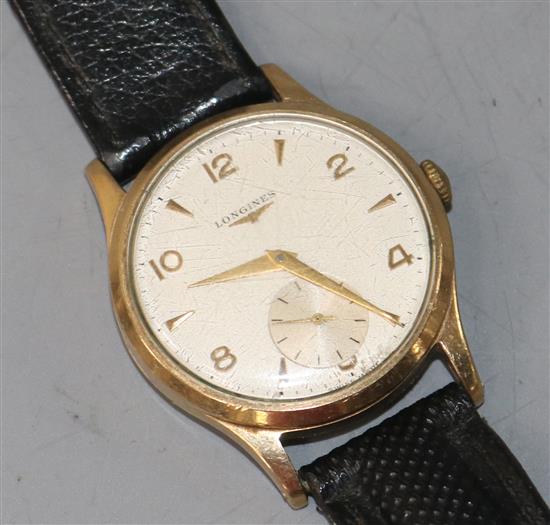 A gentleman's 9ct gold Longines manual wind wrist watch.